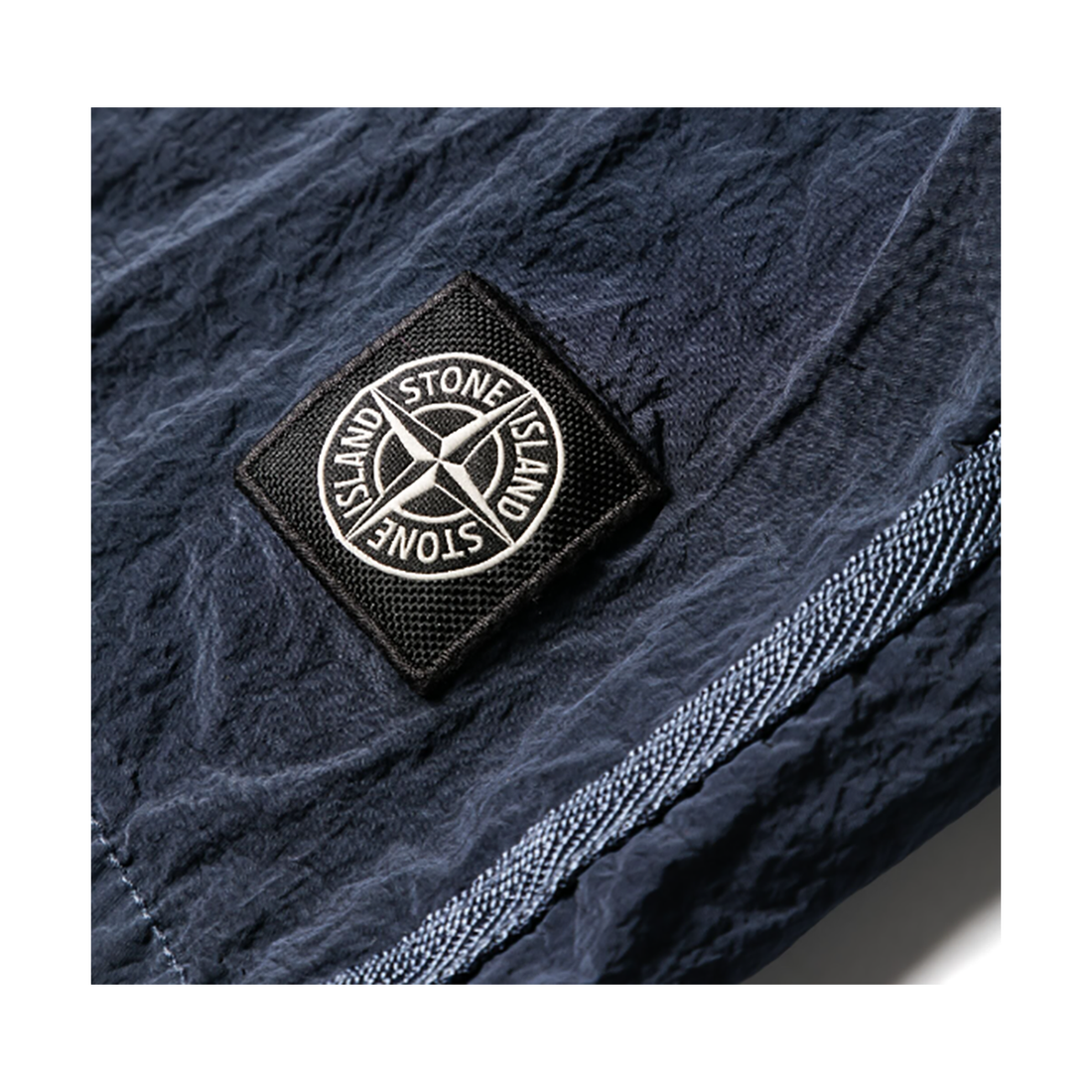 STONE ISLAND LOGO PATCH SWIM SHORTS IN BLUE